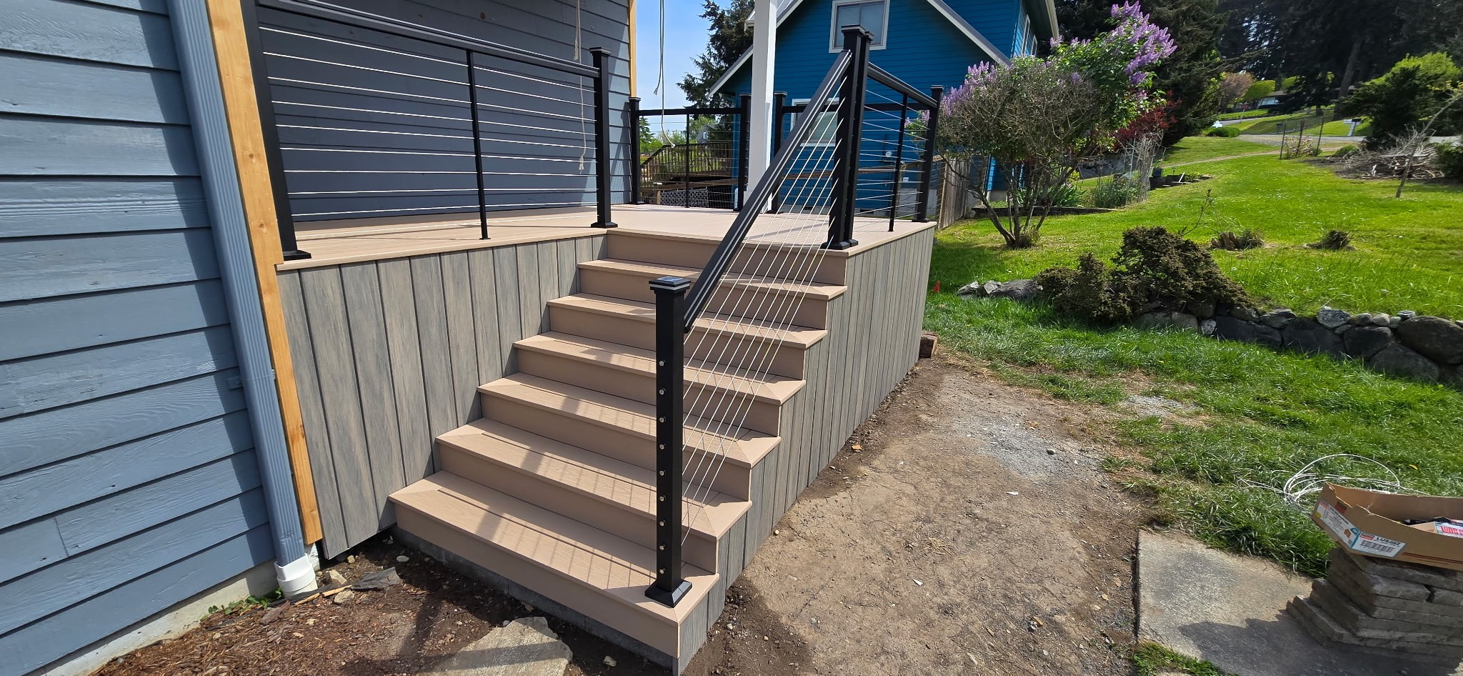 Composite front porch with cable railing and composite stairs
