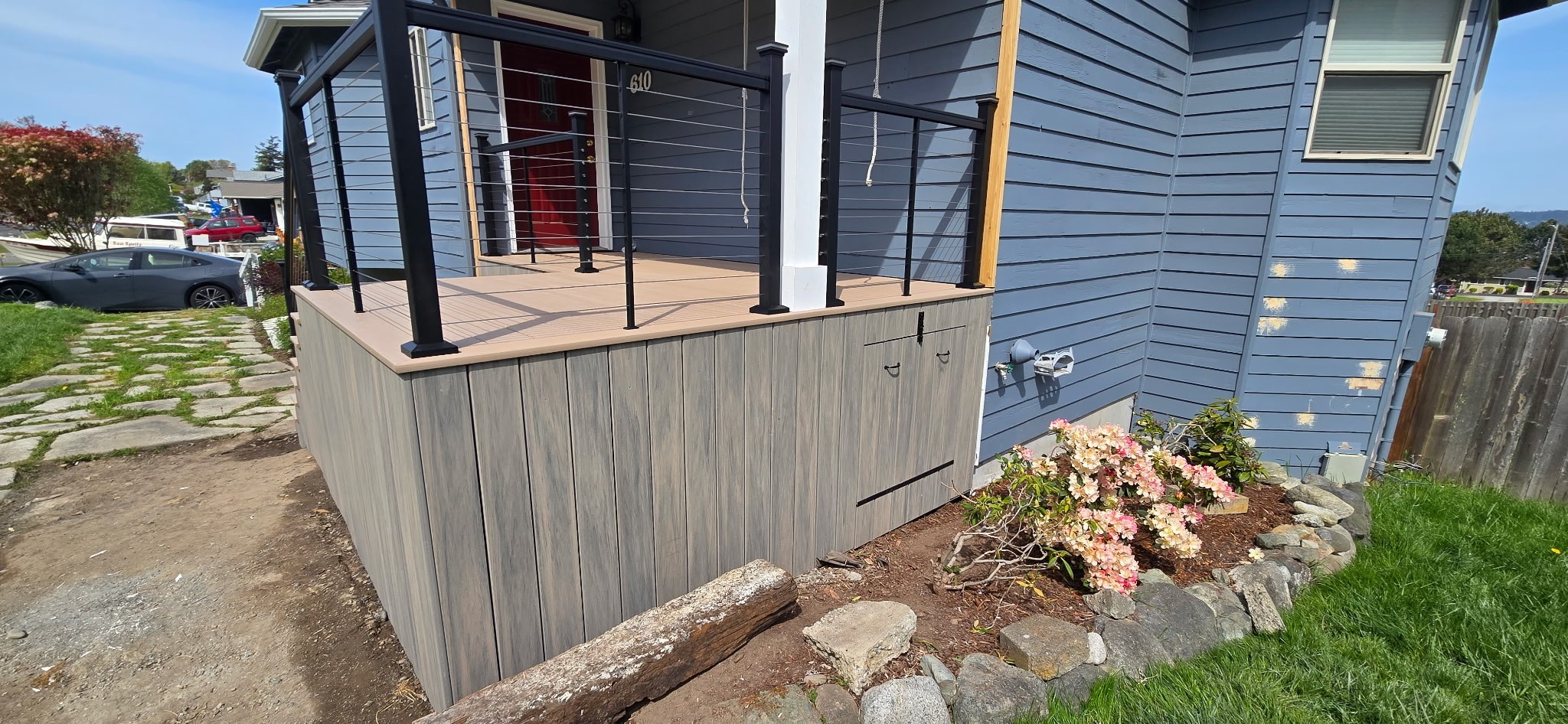 Front porch with composite decking and hidden storage access