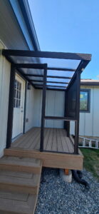 Covered back deck with steps and translucent roof in Coupeville, WA