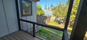 Screened covered deck railing and low-maintenance decking in Coupeville, WA
