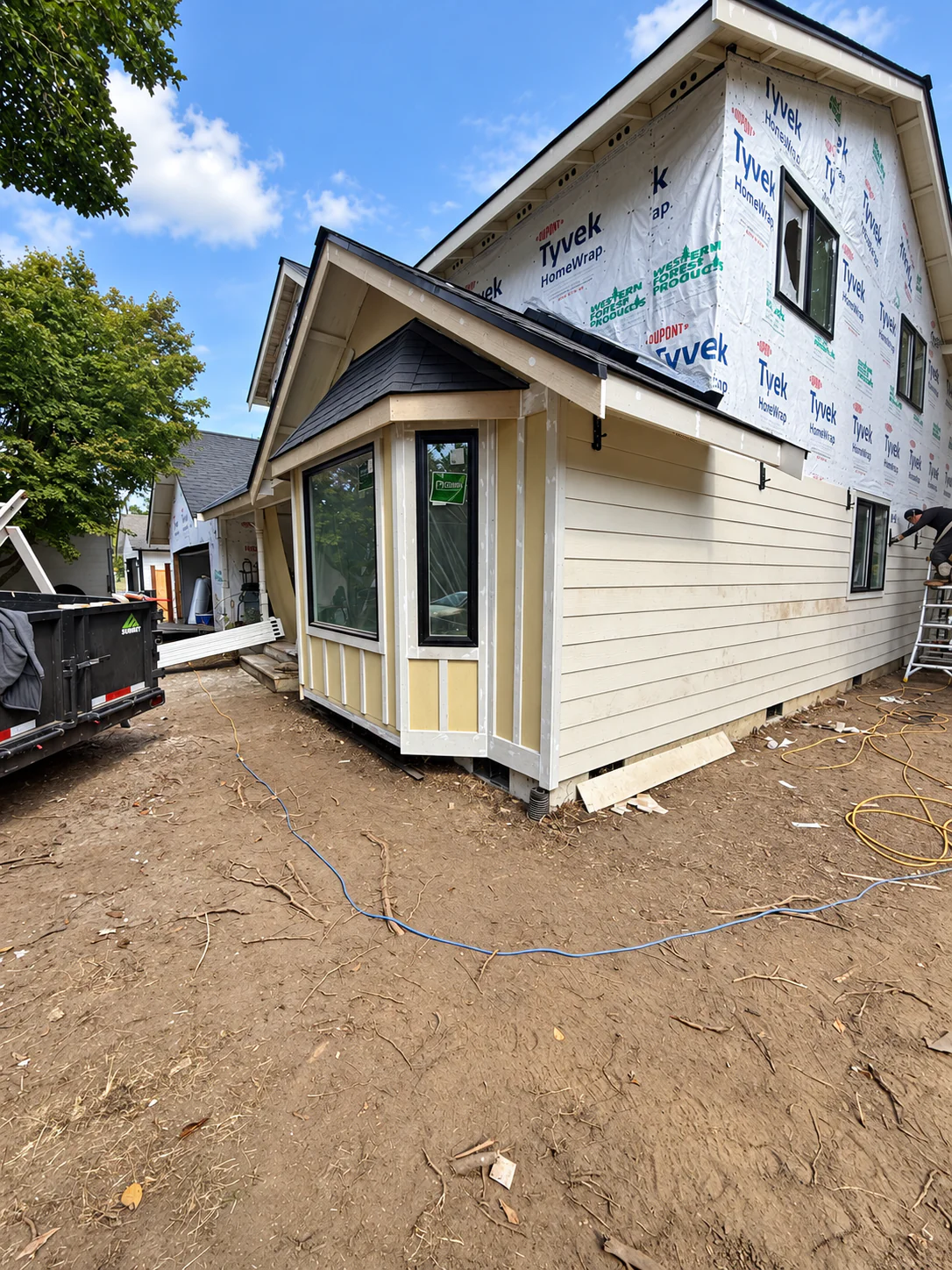 Exterior siding and window installation in progress on a Northwest Washington home