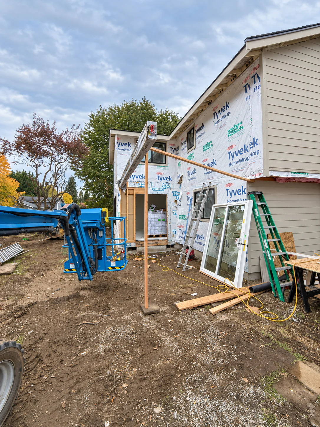 Weather-resistive barrier and window installation during an exterior remodel