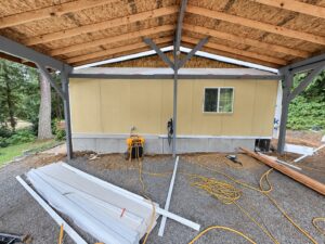 Covered structure framing and exterior renovation by Prestige Home Services, photographed October 2026